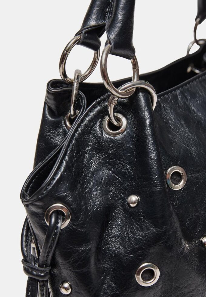 Bucket-veske med øye-detaljer