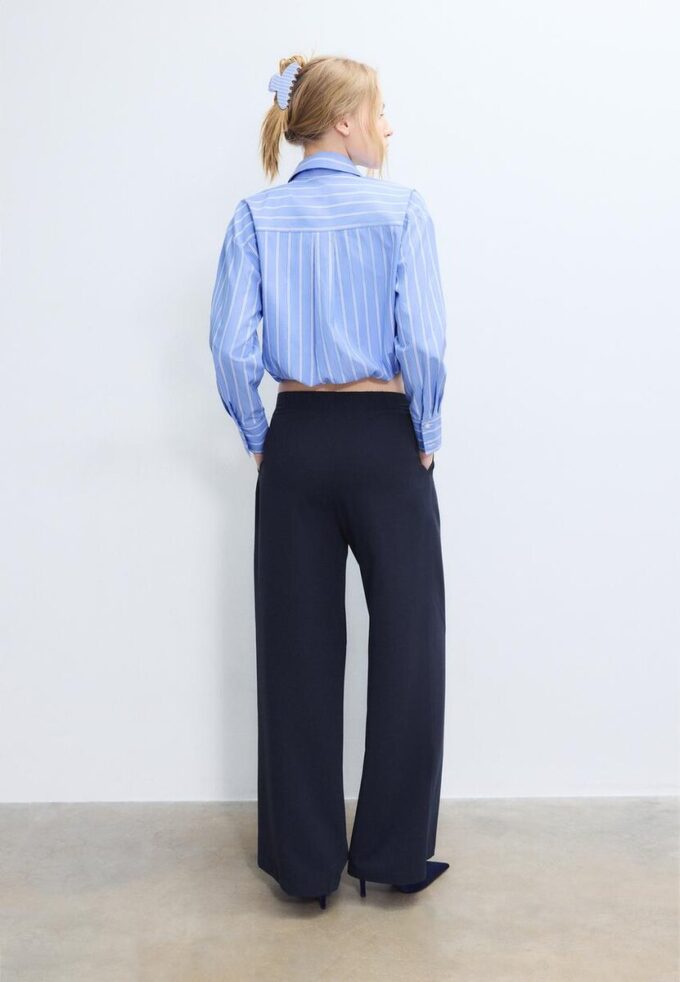 Bukser med vid ben og spennedetaljer