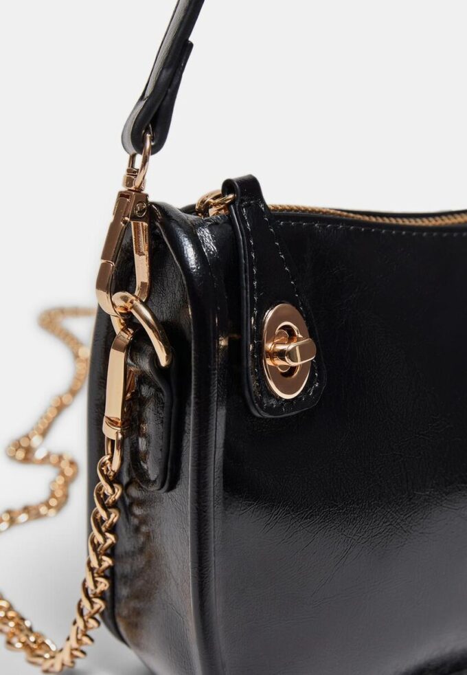 Crossbody-veske med flere bærestillinger