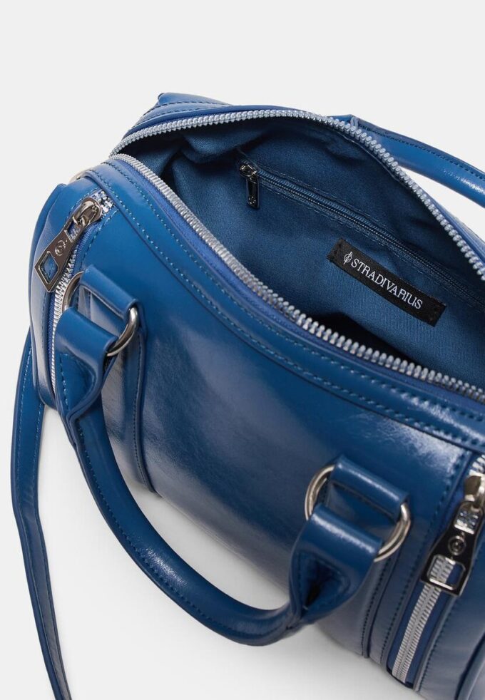 Crossbody-veske med glidelåsdetaljer