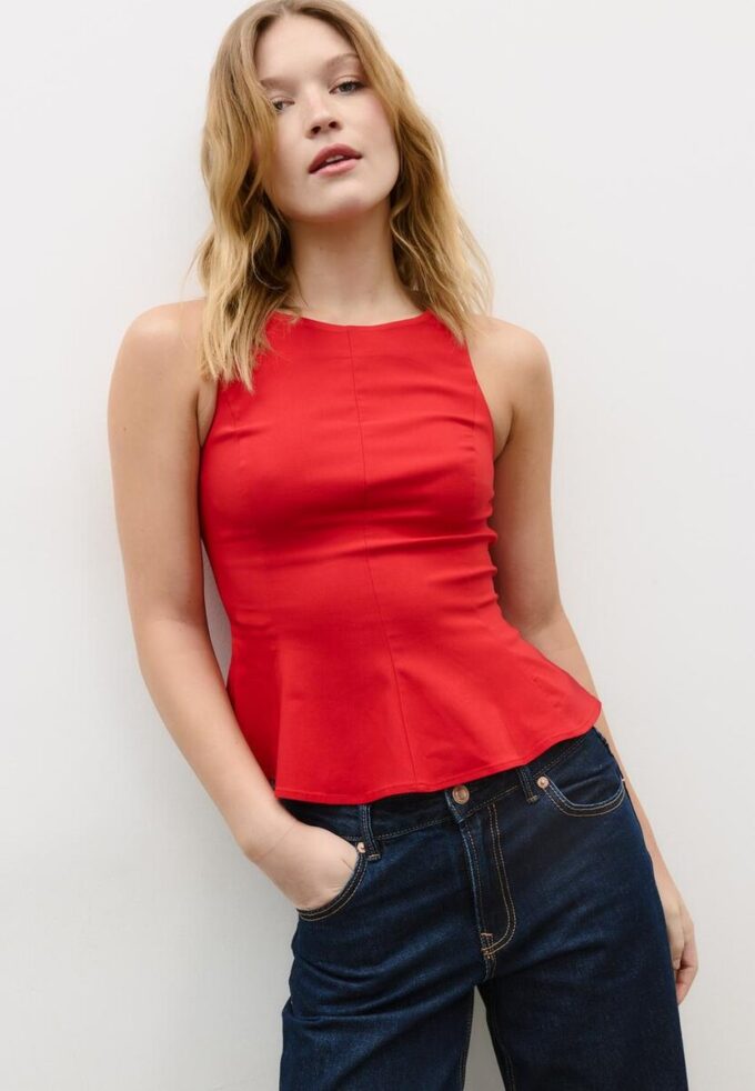 Ermeløs peplum-topper