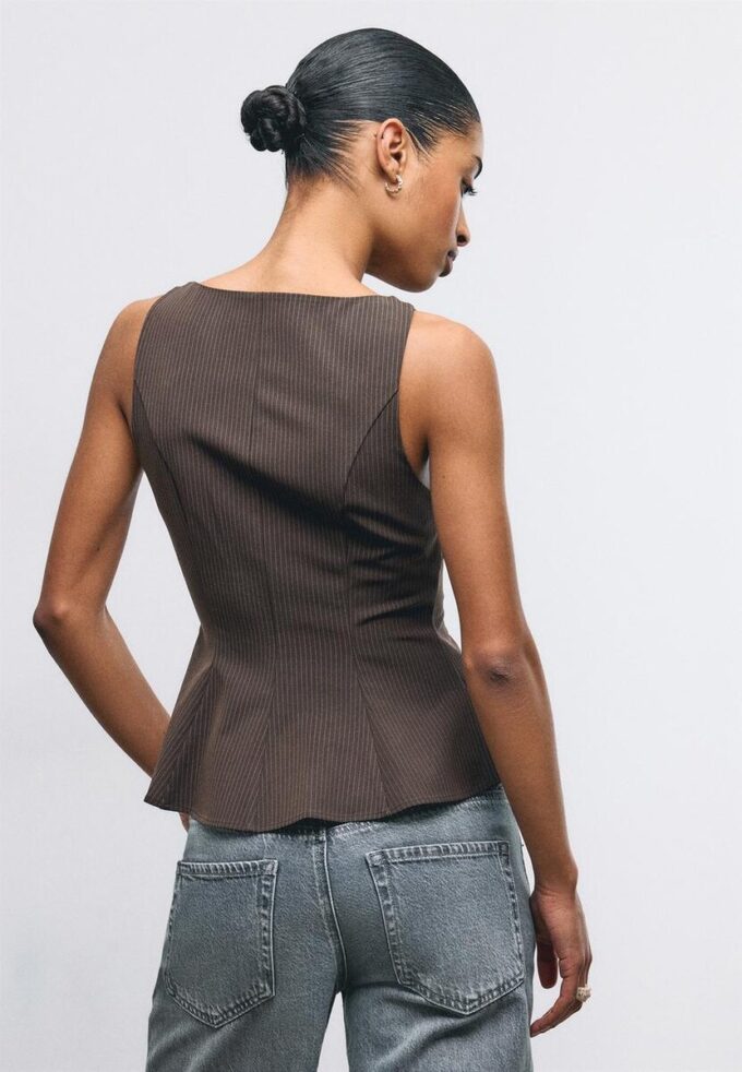 Ermeløs peplum-topper