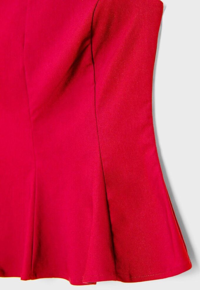 Ermeløs peplum-topper