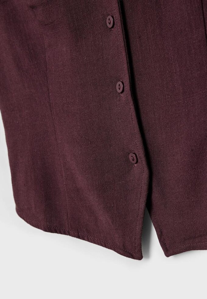 Ermeløs topp med knapper