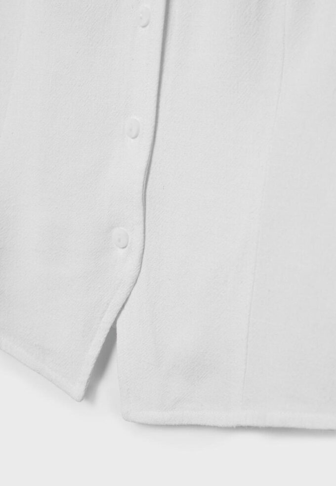 Ermeløs topp med knapper