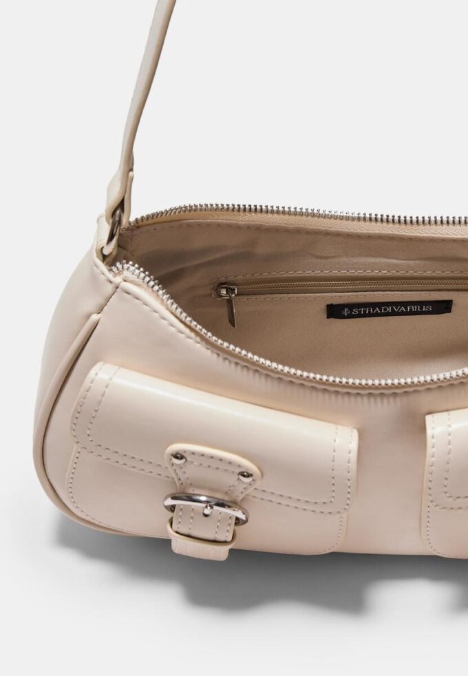 Halvmåne-skulderveske med lommer