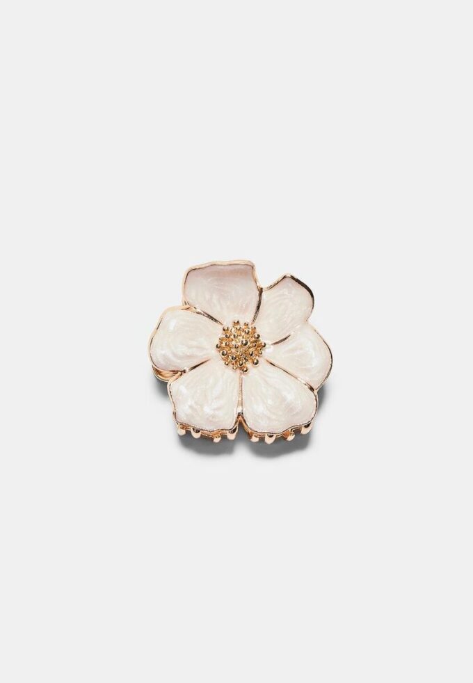 Hårspenne med metallblomst