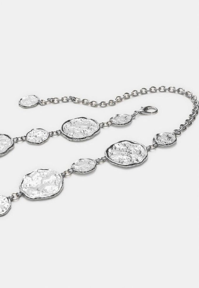 Metallbelter med runde plater