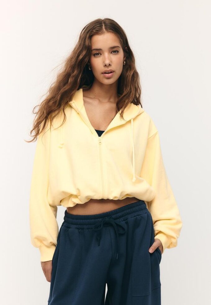 Mønstret bomber-sweatshirt med hette og trykk