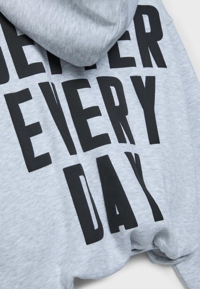 Mønstret bomber-sweatshirt med hette og trykk