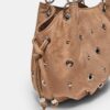 Rund crossbody-veske med øyedetaljer