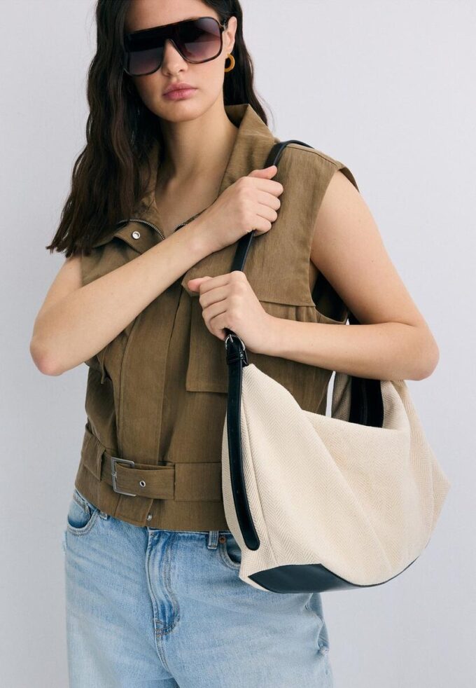 Skulderveske i kontrastfarget lerret