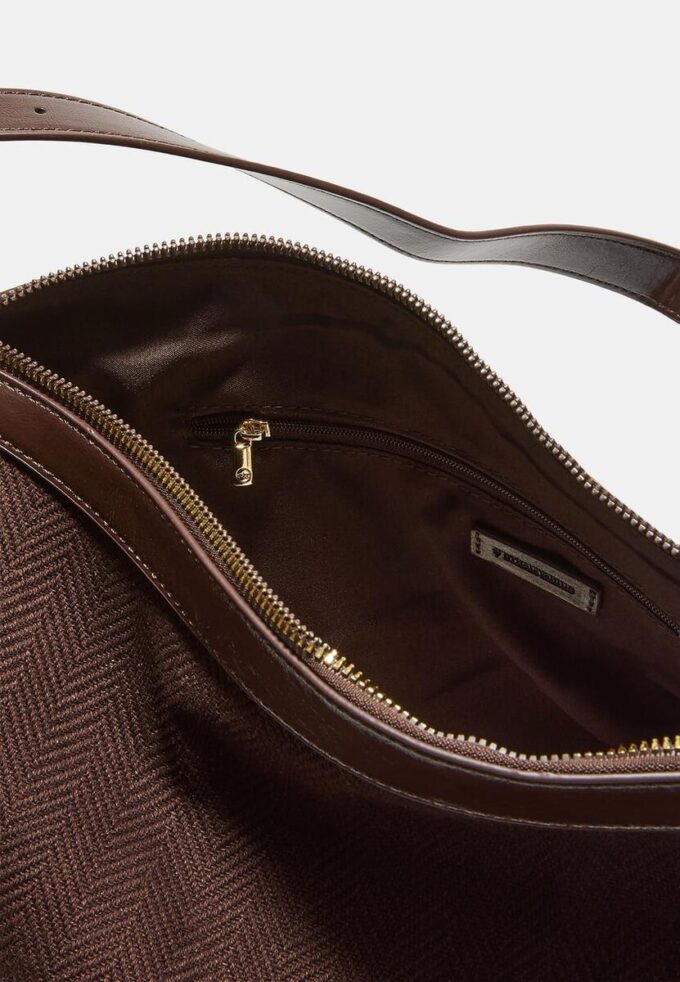 Skulderveske i kontrastfarget lerret