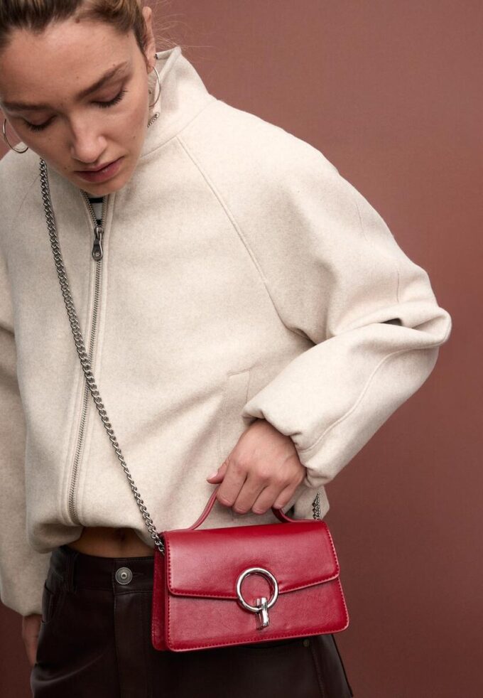 Skulderveske med rund lås