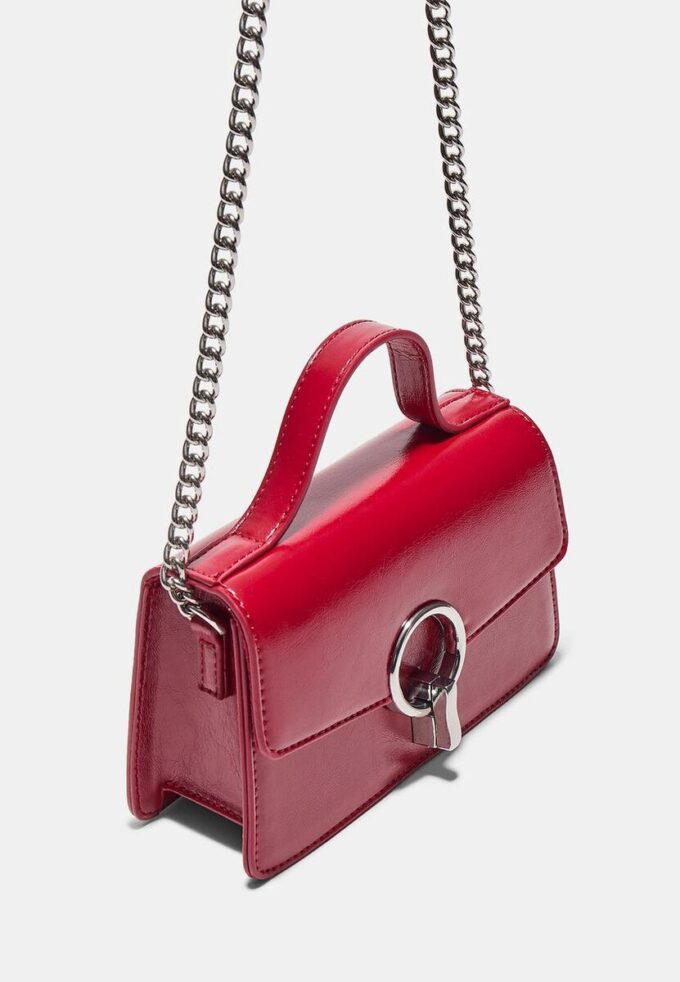 Skulderveske med rund lås