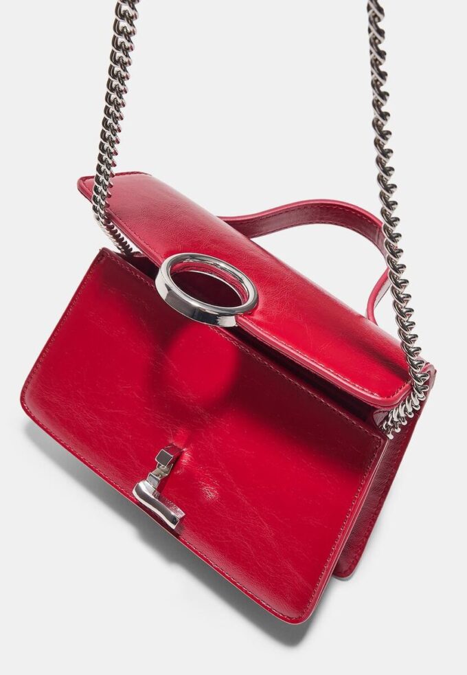 Skulderveske med rund lås