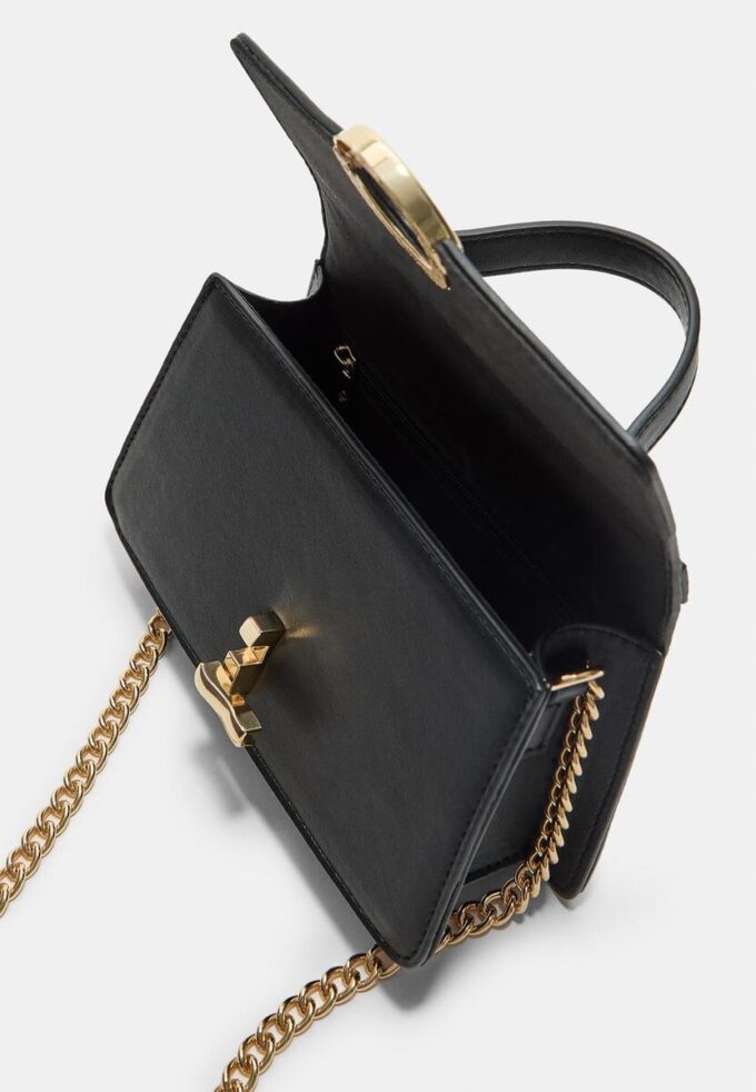 Skulderveske med rund lås