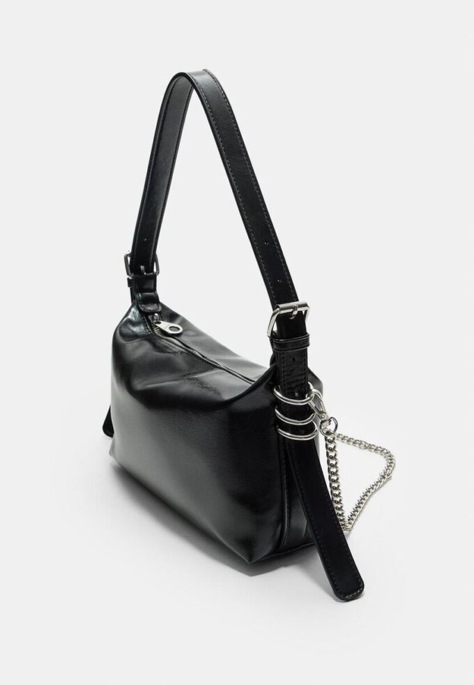 Skulderveske med stroppdetaljer