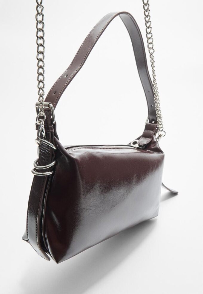 Skulderveske med stroppdetaljer