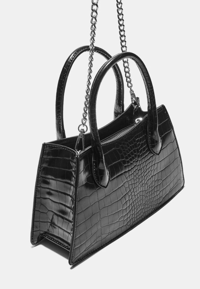 Trapesformet skulderveske med kokosnøtteffekt