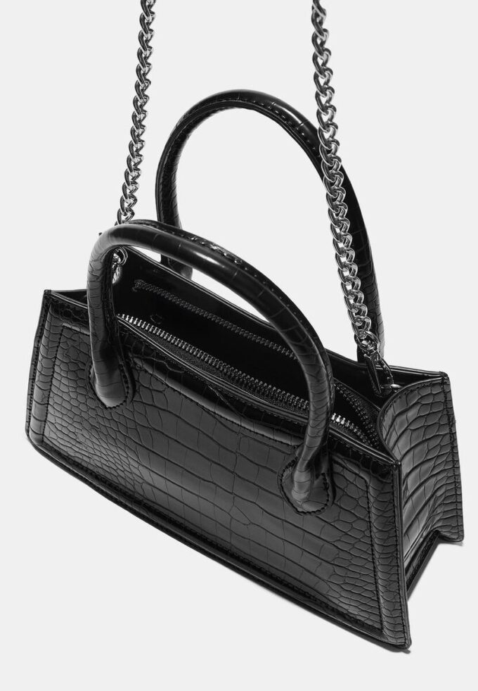 Trapesformet skulderveske med kokosnøtteffekt